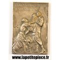 Médaille Belge vendue au profils de l'habillement des enfants des soldats Belges. 