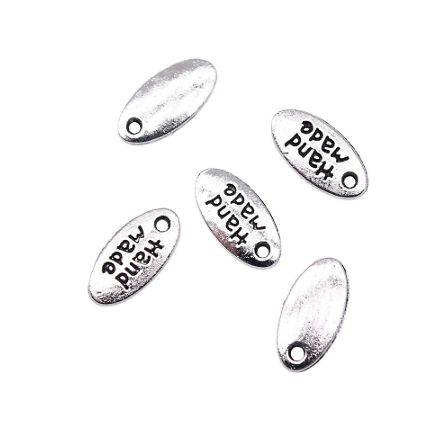 4 mini étiquettes ovales "handmade" en métal argenté 11x6mm